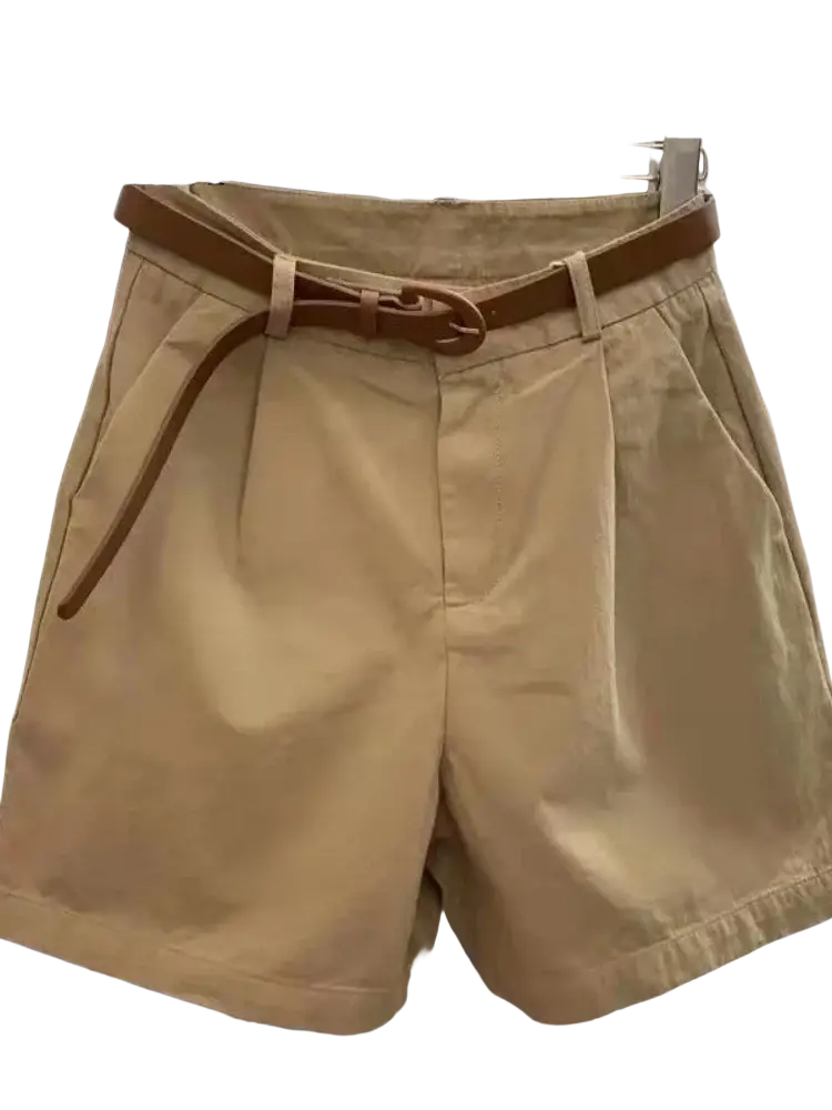 Beige pleated women casual wide leg summer shorts made of lightweight fabric with a matching brown belt