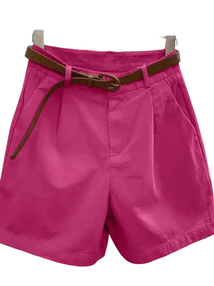 Women casual wide leg summer shorts in bright pink pleated fabric with a brown leather belt for a stylish look