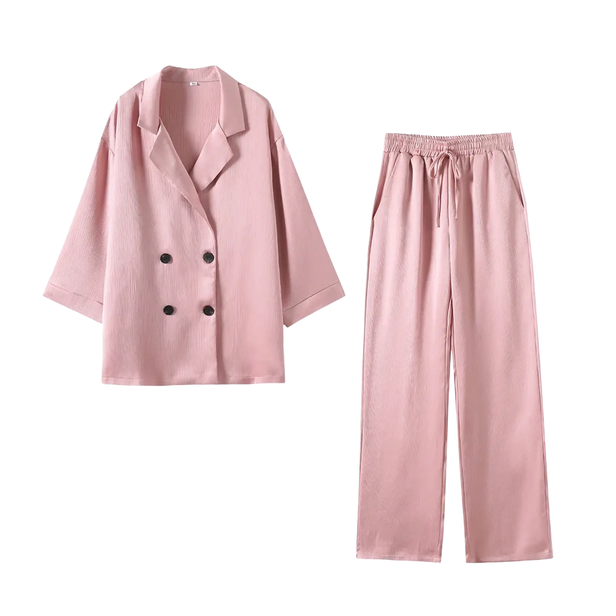 A soft pink women corduroy pant suit with a double-breasted blazer and loose-fitting pants with elastic waistband