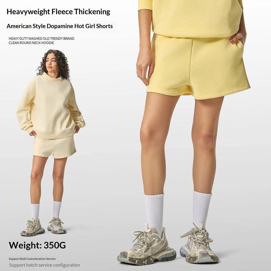 Yellow women cotton casual shorts made of heavyweight fleece paired with a matching round neck hoodie top