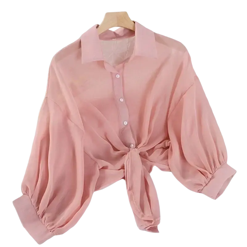 A soft pink women cotton chiffon blouse with classic collar button-down front and puffed lantern sleeve style tied at waist