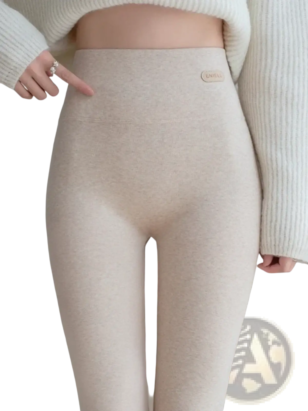 Beige high-waisted women cotton fleece slimming leggings with soft textured knit fabric and small brand tag at the waistband