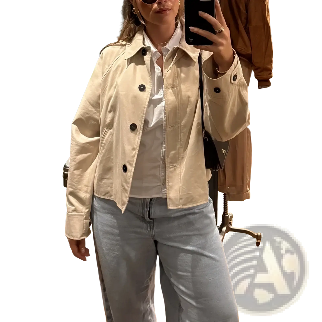 Women cropped trench coat beige short windbreaker featuring a beige utility-style jacket with black buttons and classic collar