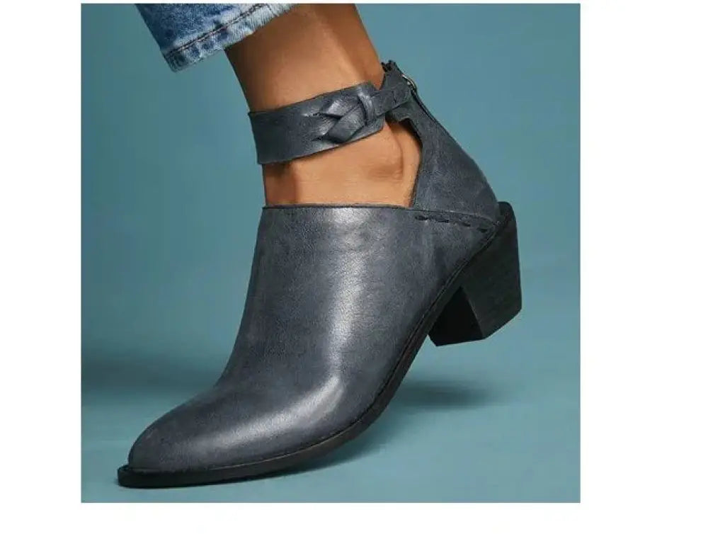 Dark gray suede women’s cut-out leather ankle boot with chunky heel and adjustable strap around the foot