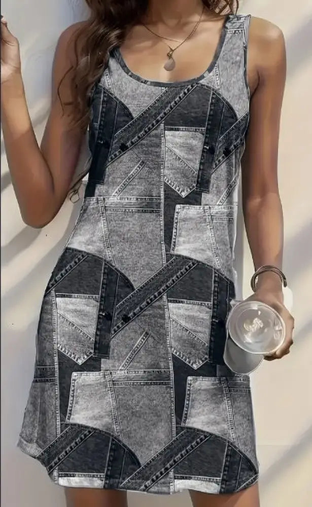 Women’s patchwork denim cutout mini dress with sleeveless gray and black geometric pattern and stitched seams