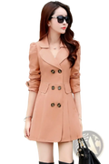A stylish peach-colored women double-breasted trench coat with decorative buttons and rolled-up sleeves
