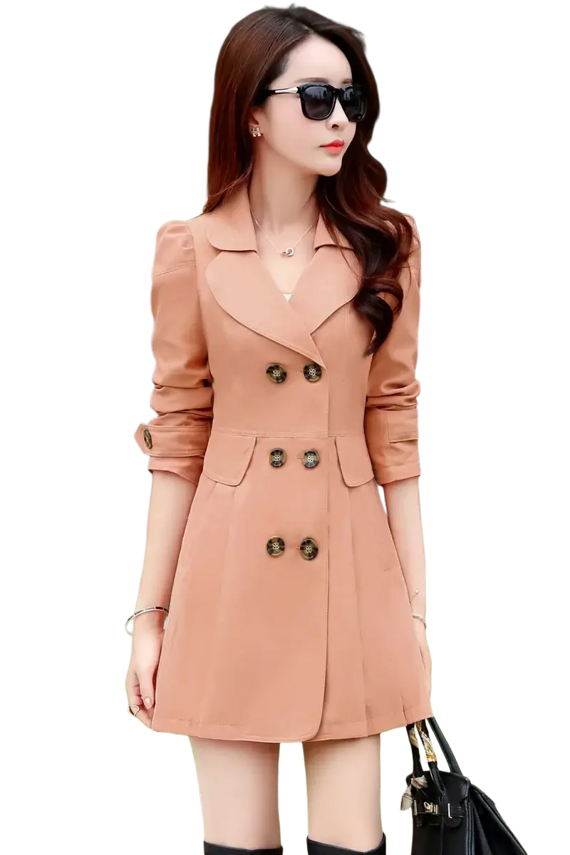A stylish peach-colored women double-breasted trench coat with decorative buttons and rolled-up sleeves