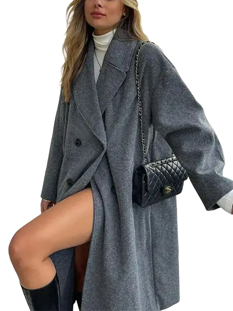 Women double breasted wool coat paired with a black quilted chain shoulder bag with gold tone hardware
