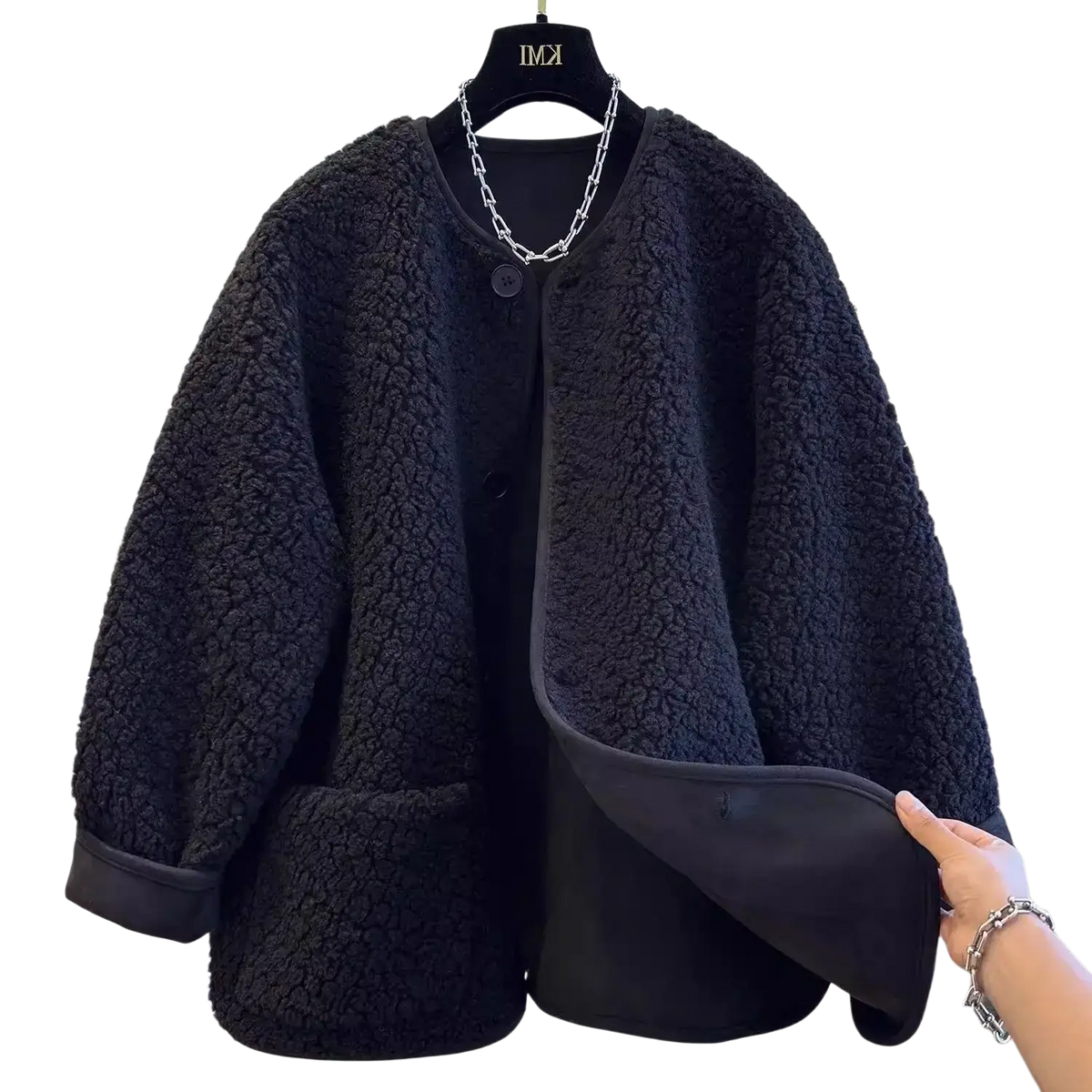 Black faux shearling cropped coat for women featuring soft textured exterior and smooth black lining for winter use