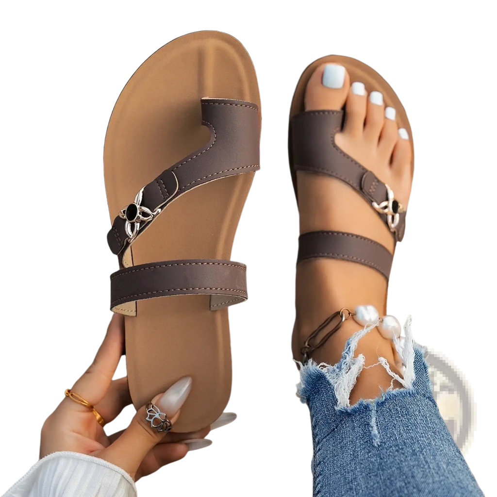 Women flat brown leather thong sandals with silver metal buckles and toe loop design