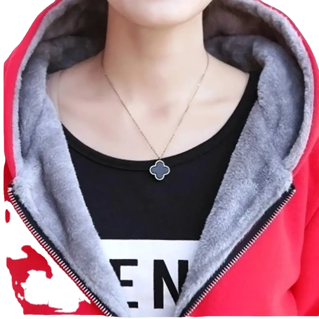 Delicate silver chain necklace with dark gray four leaf clover pendant paired with women fleece lined hooded zipper jacket