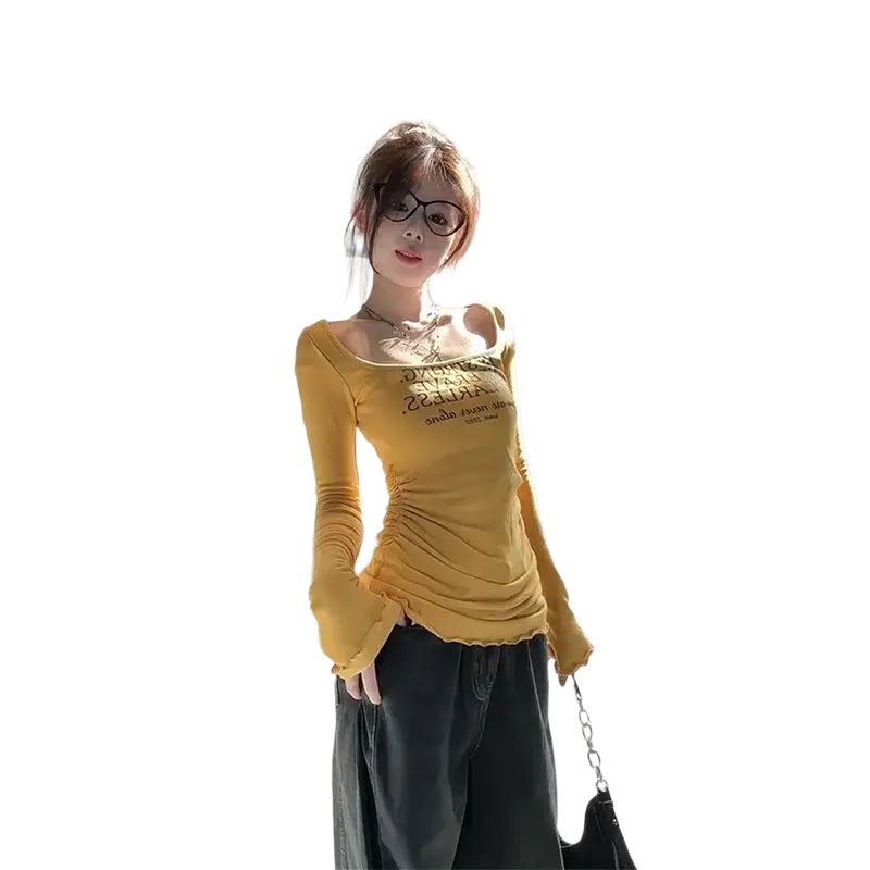 Yellow long-sleeved floral slim t-shirt with ruched detailing and square neckline featuring black printed text