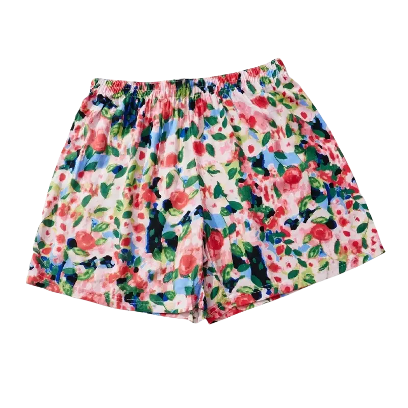 Women floral viscose lounge shorts with a loose elastic waistband and vibrant red roses on a light pink background