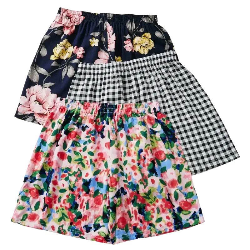 Three pairs of women floral viscose lounge shorts with elastic waist in navy floral, black gingham, and multicolor patterns