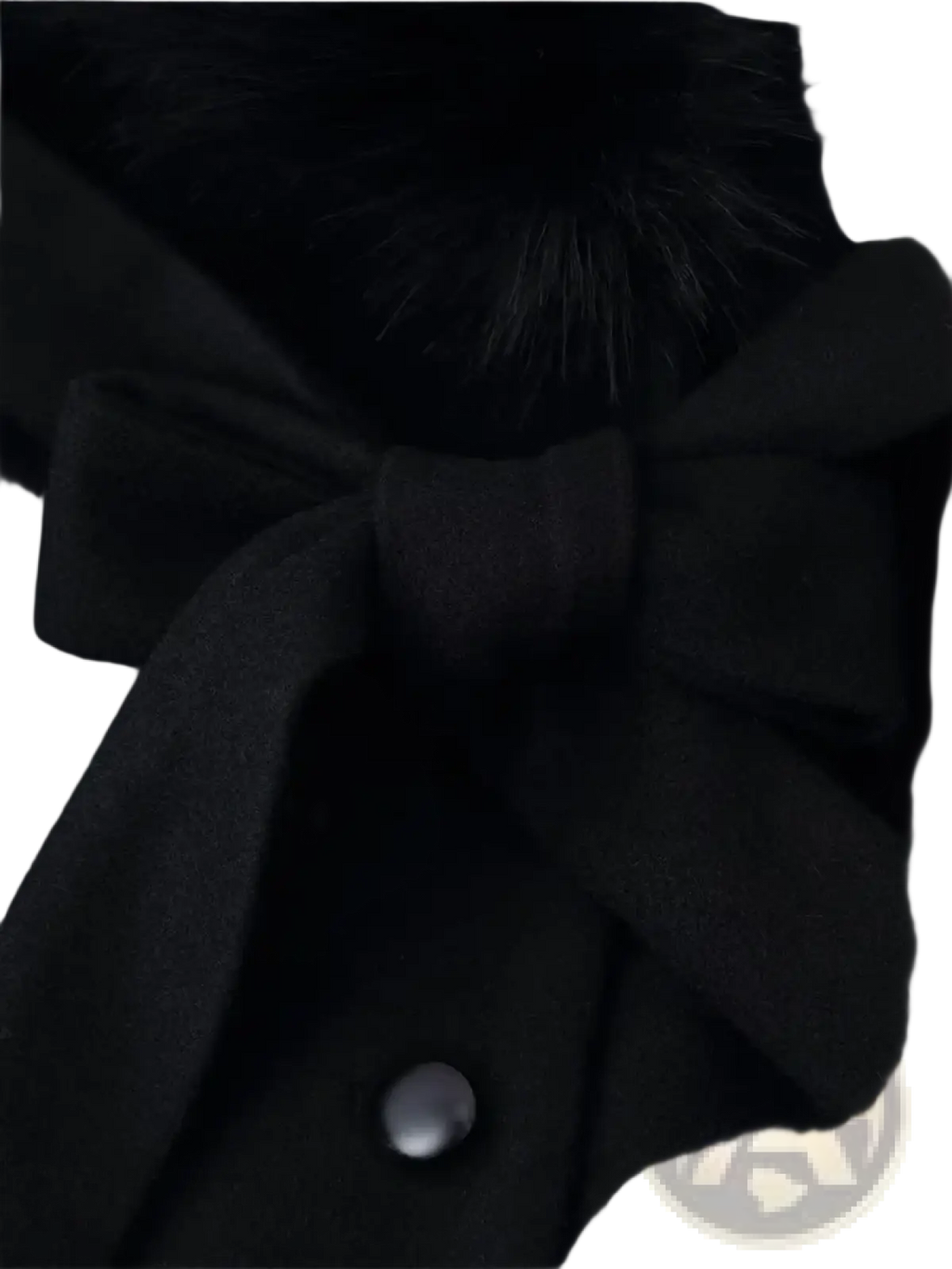 Black velvet bow tie with fur trim and silver button on a women fur collar woolen coat
