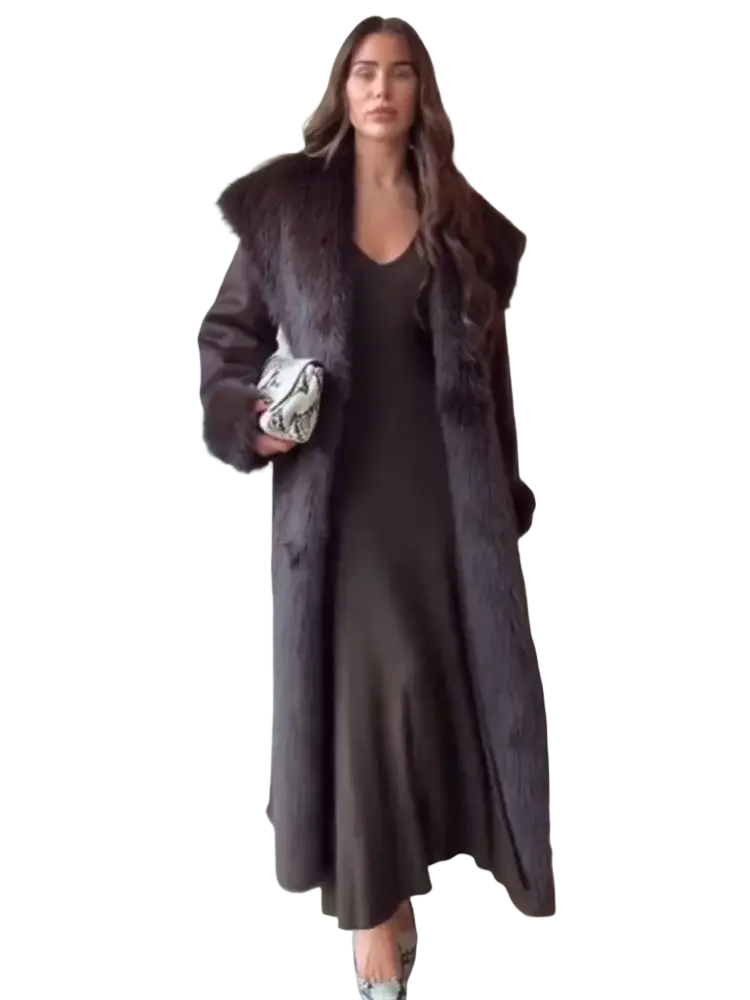 A dark gray satin slip dress with v-neckline and flowing silhouette paired with a women fur collar woolen coat