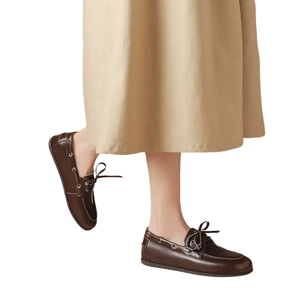 Women genuine leather boat shoes in brown with black laces and silver eyelets for casual wear