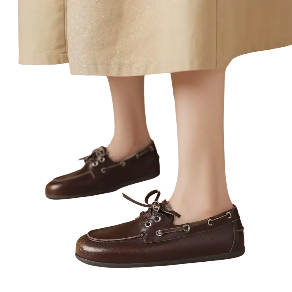 Women genuine leather boat shoes in brown with dark laces and silver eyelets for casual and nautical wear