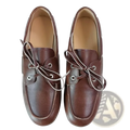 Women genuine leather boat shoes in brown with light-colored laces and silver eyelets showcasing classic craftsmanship