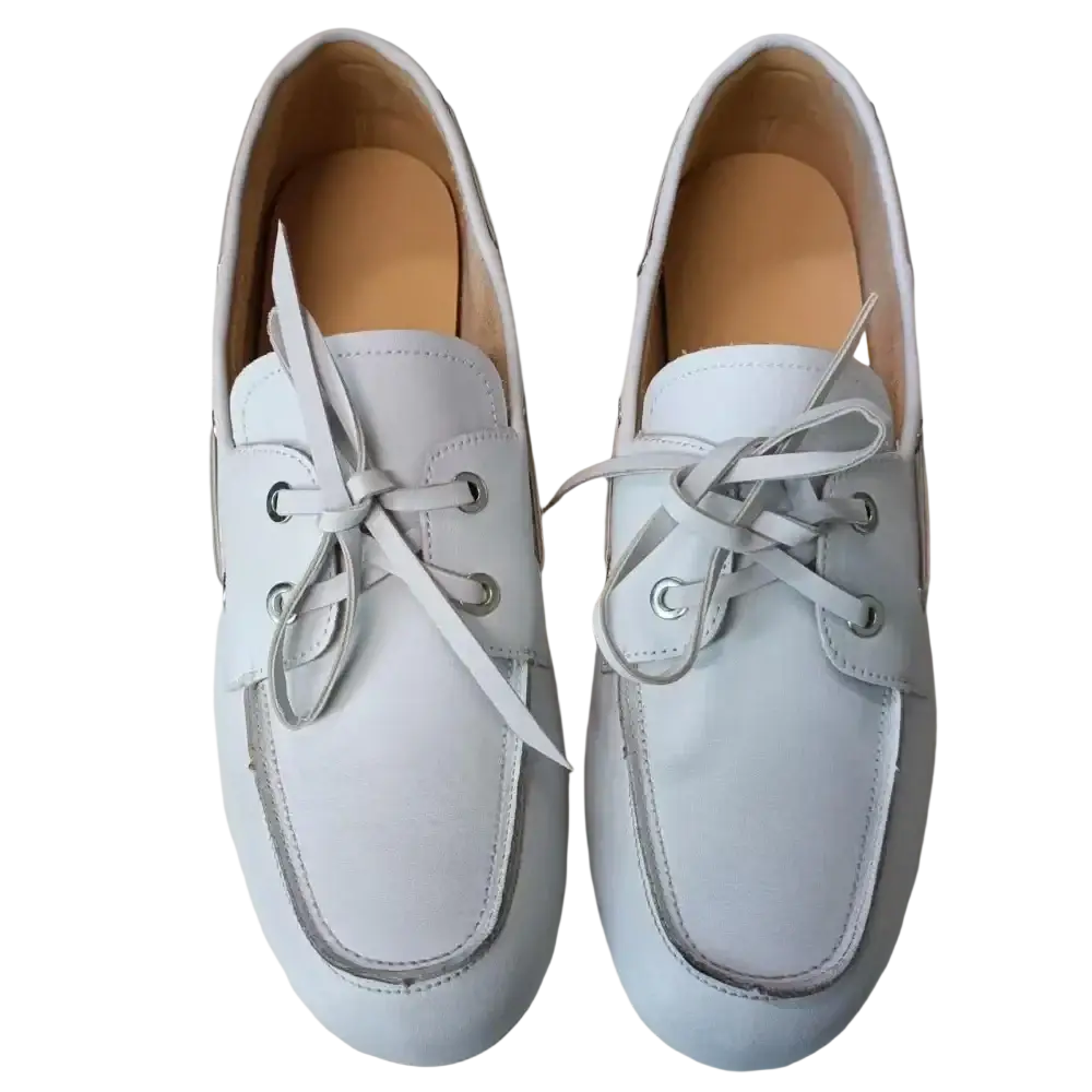 Women genuine leather boat shoes in white with matching laces and silver eyelets crafted from genuine leather