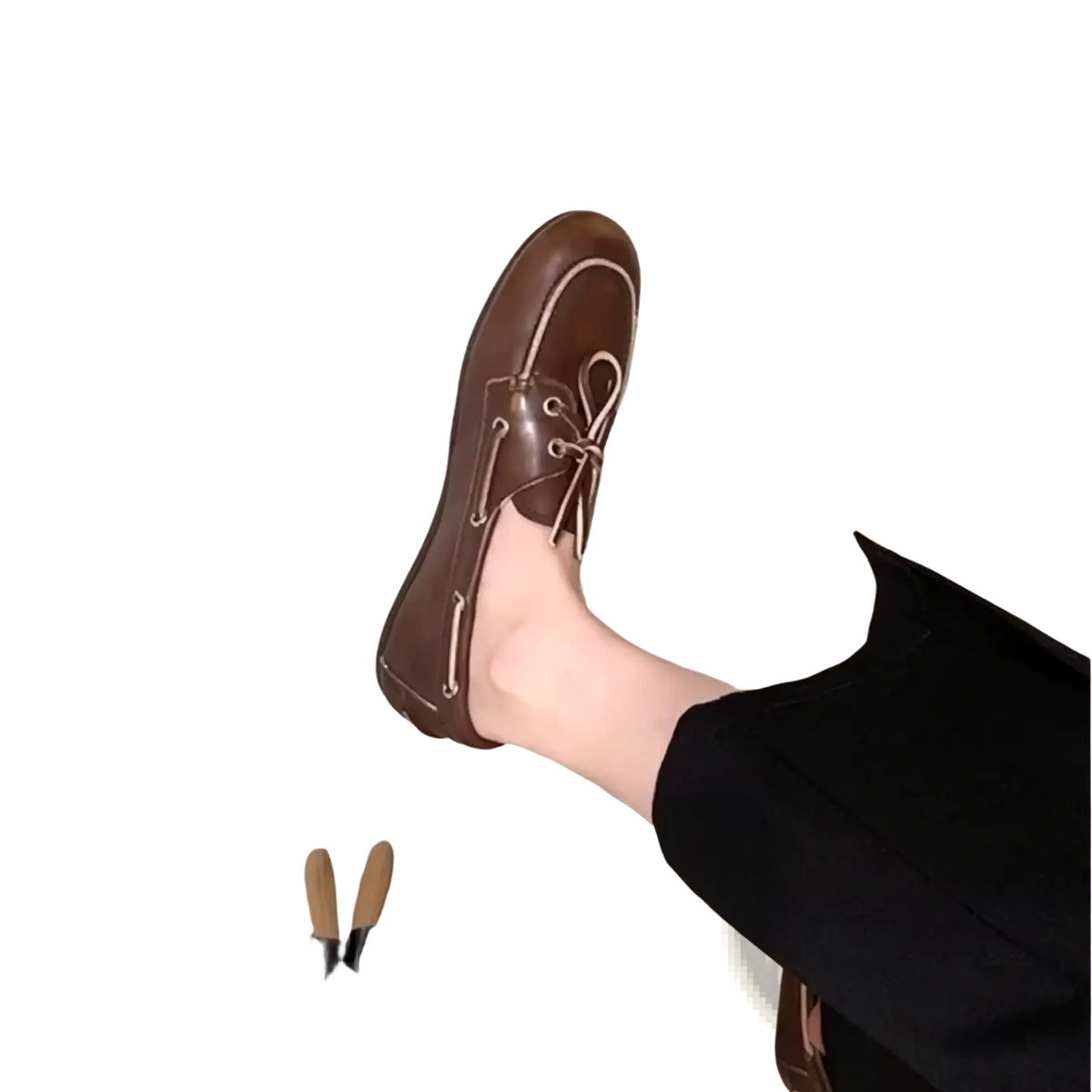 Brown leather boat shoe with light-colored laces featuring a classic minimalist design in women genuine leather loafers