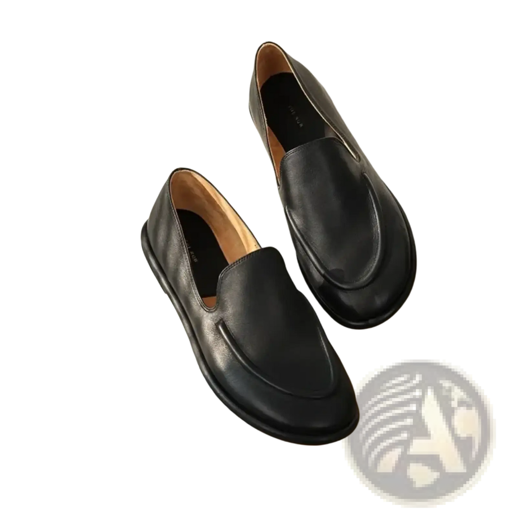 Women genuine leather slip-on flats in black with a smooth matte finish and subtle stitching details