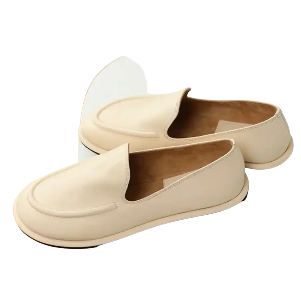 Cream-colored women genuine leather slip-on flats with minimalist design and black rubber soles