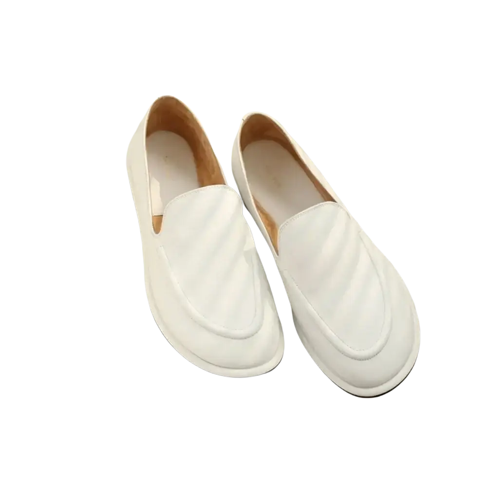 Women genuine leather slip-on flats in white with a subtle quilted design and black soles
