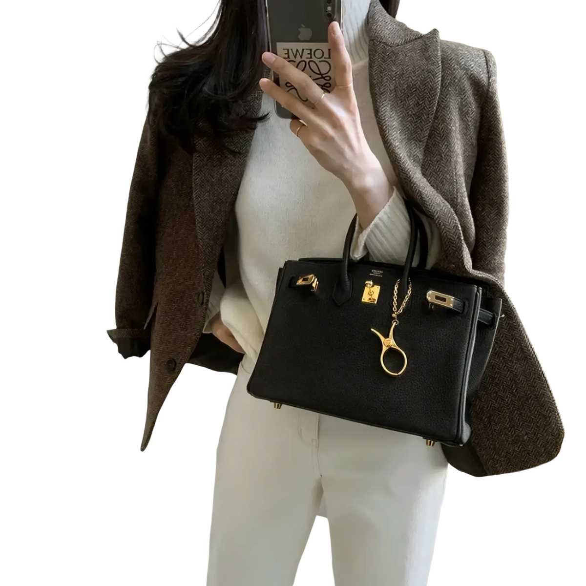 Black leather hermès birkin handbag with gold-tone hardware and golden scissors charm paired with women gray herringbone wool slim fit blazer