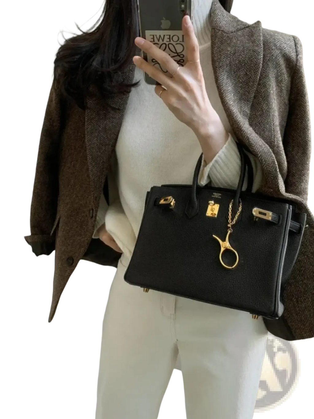 Black leather hermès birkin handbag with gold-tone hardware and scissors charm alongside women gray herringbone wool blazer