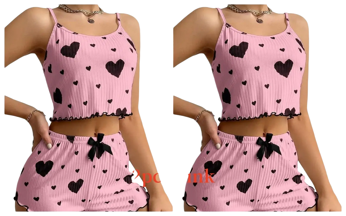 Pink ribbed two-piece pajama set with black heart patterns, matching bows, soft tank and shorts with 8cm bottoms length