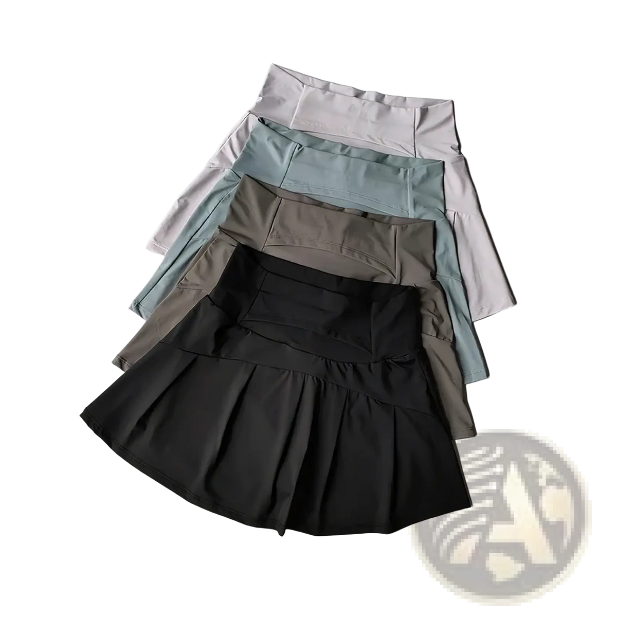 A stack of women high waist athletic tennis skirts in muted black gray and light blue quick dry fabric
