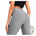 Women high waisted compression yoga leggings in gray textured fabric with a honeycomb pattern