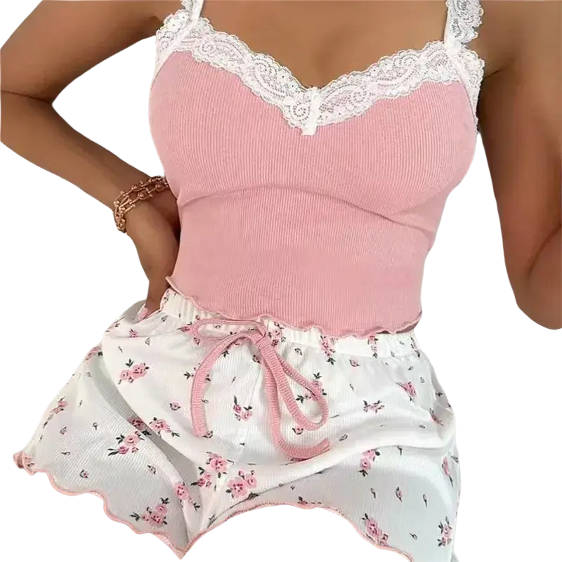 Women home wear lace pajama set featuring a pink ribbed camisole with white lace trim and matching floral shorts