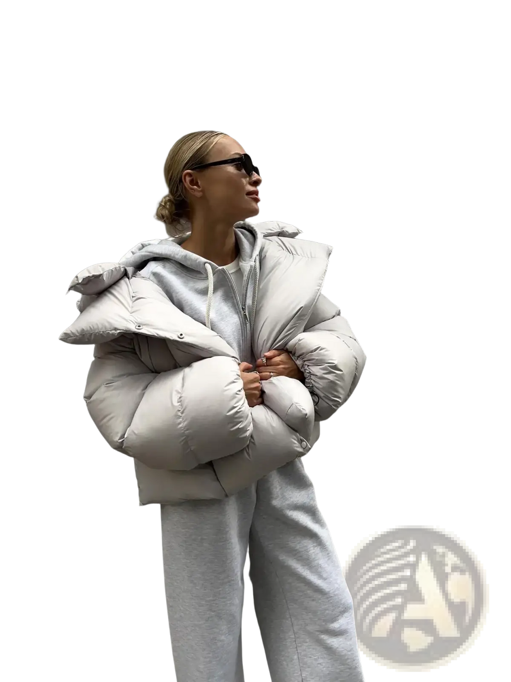A puffy light gray quilted women hooded winter puffer jacket with button details for cold weather