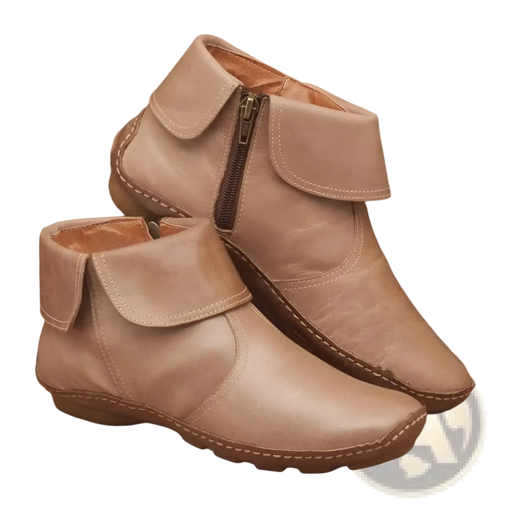 Beige leather women ankle boots with inner side zipper and visible stitching along the edges