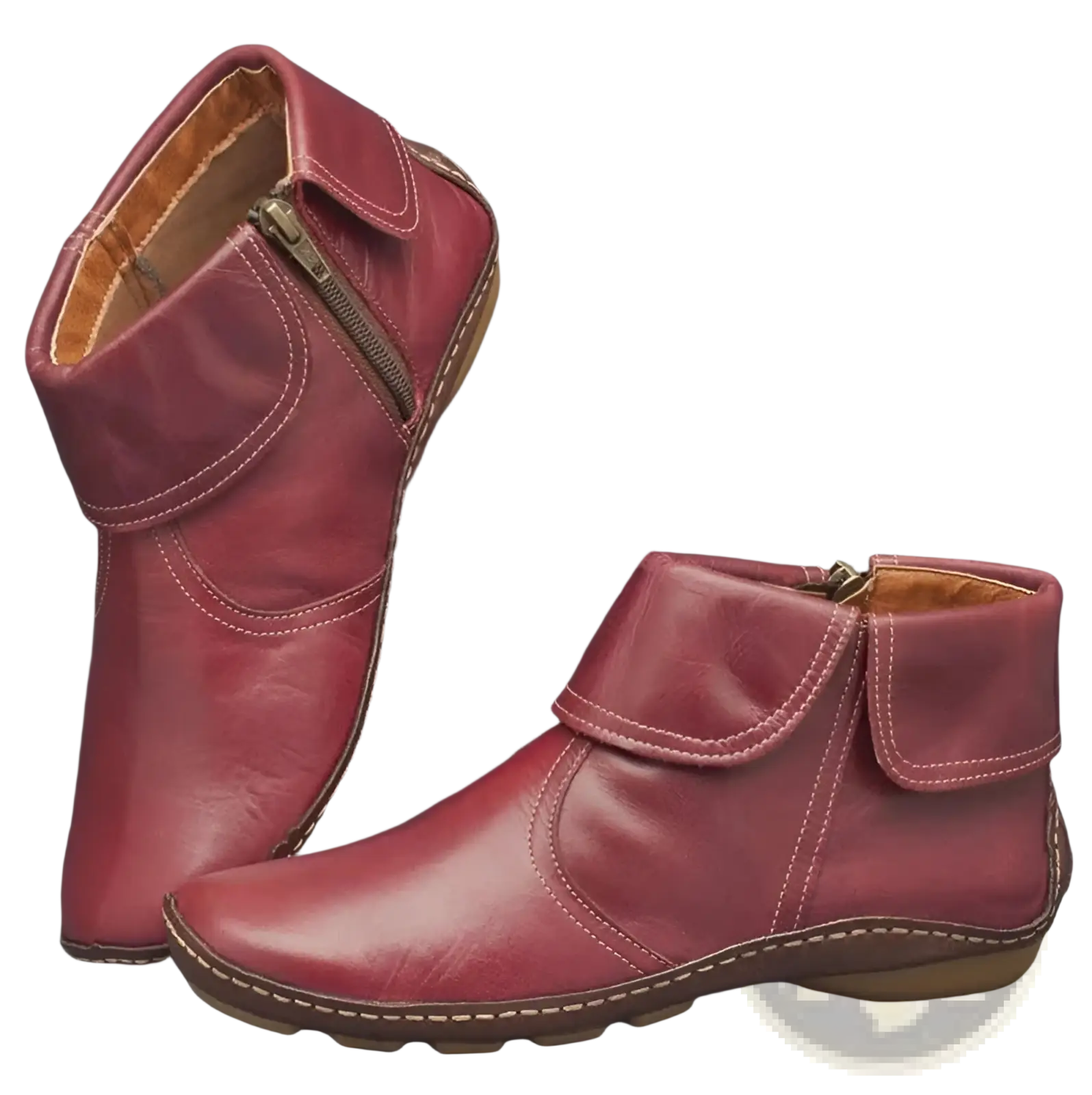 Pair of burgundy leather women ankle boots with side zipper and white stitching along the seams