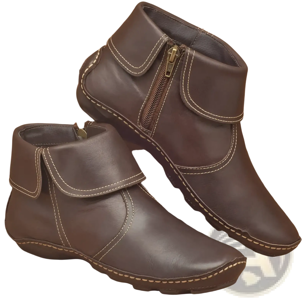 Women leather ankle boots in brown with side zipper and contrasting white stitching on the inner side