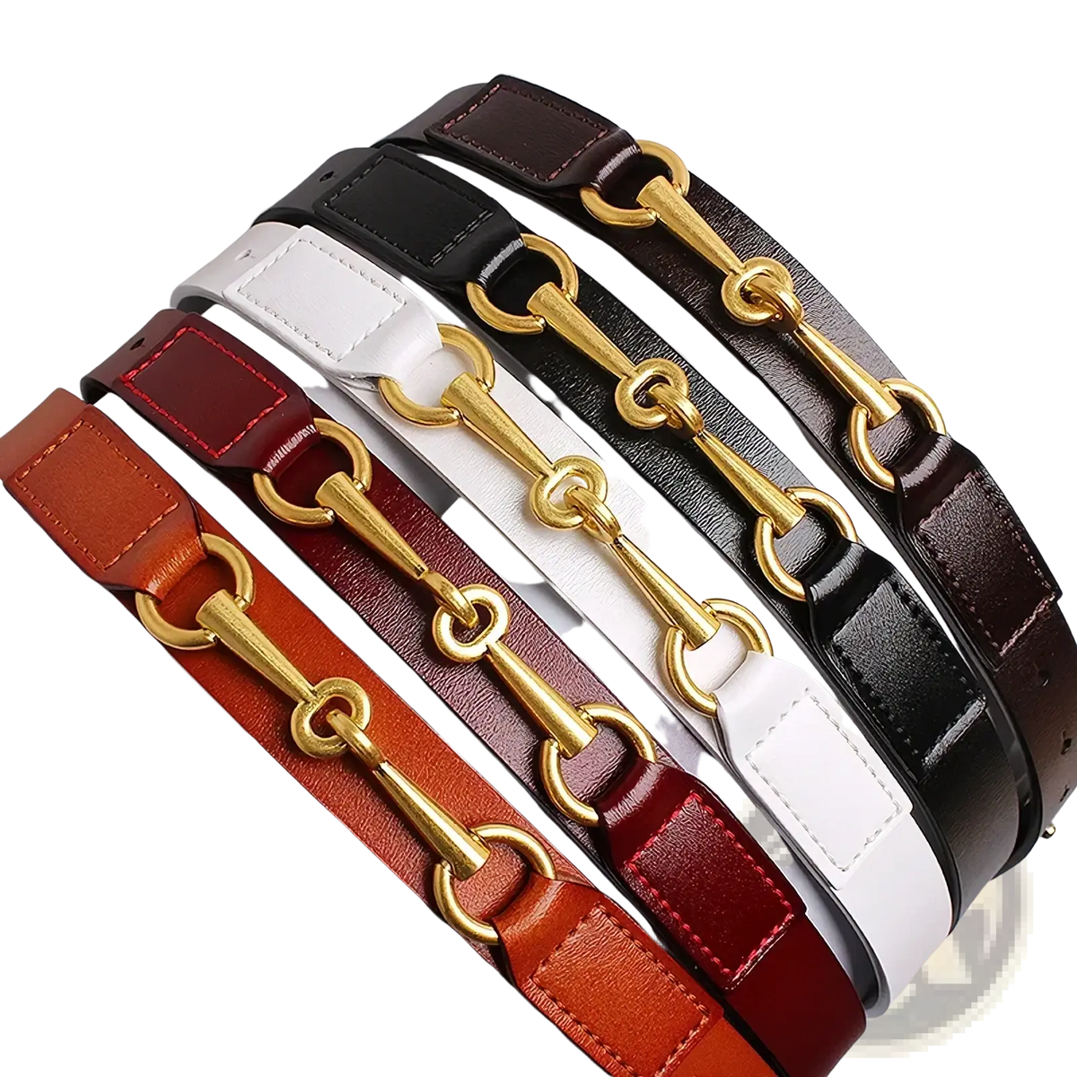 A collection of women leather belts in brown black white and red with gold horsebit buckle hardware