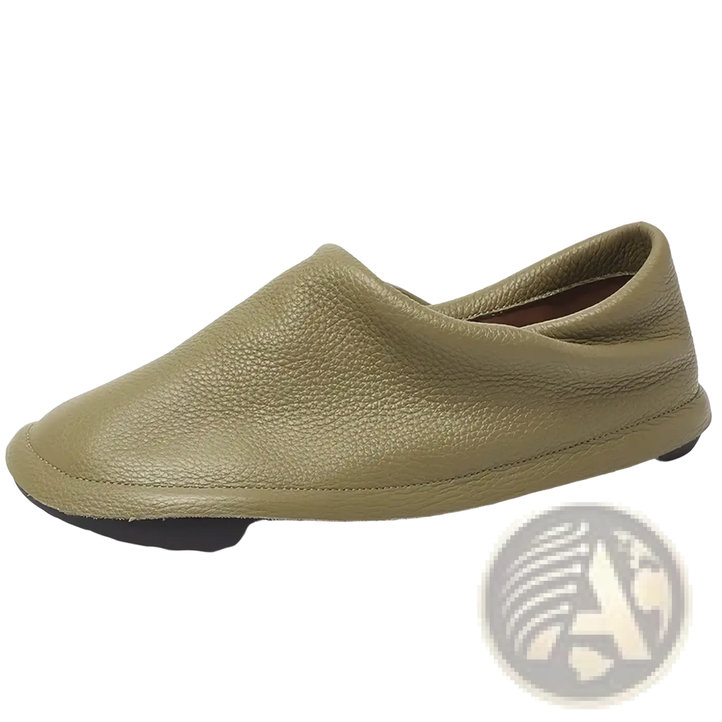 Olive green leather slip-on loafer with pebbled texture and black rubber sole for comfortable women’s work footwear