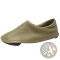 Olive green leather slip-on loafer with pebbled texture and black rubber sole for comfortable women’s work footwear