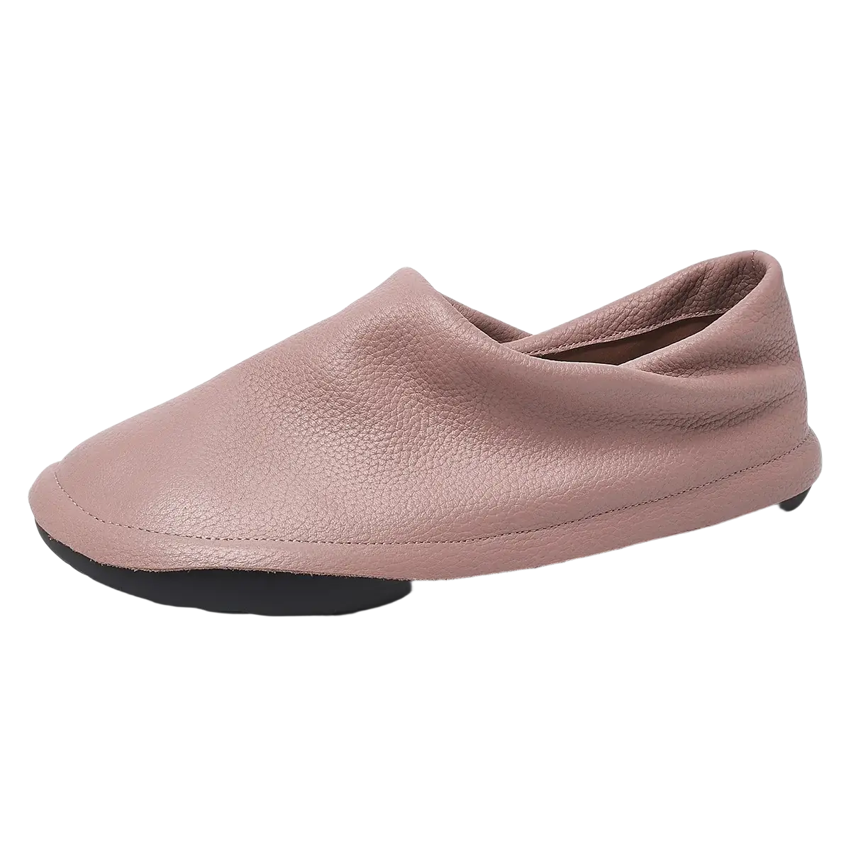 A soft pink leather slip-on loafer with pebbled texture and black rubber sole for comfortable work footwear