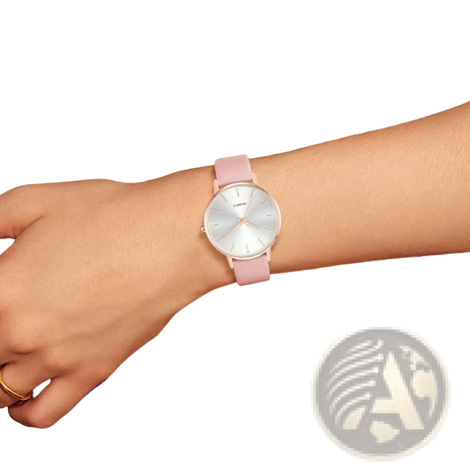 A women leather quartz watch with a delicate pink silicone strap and minimalist silver-toned zurro dial