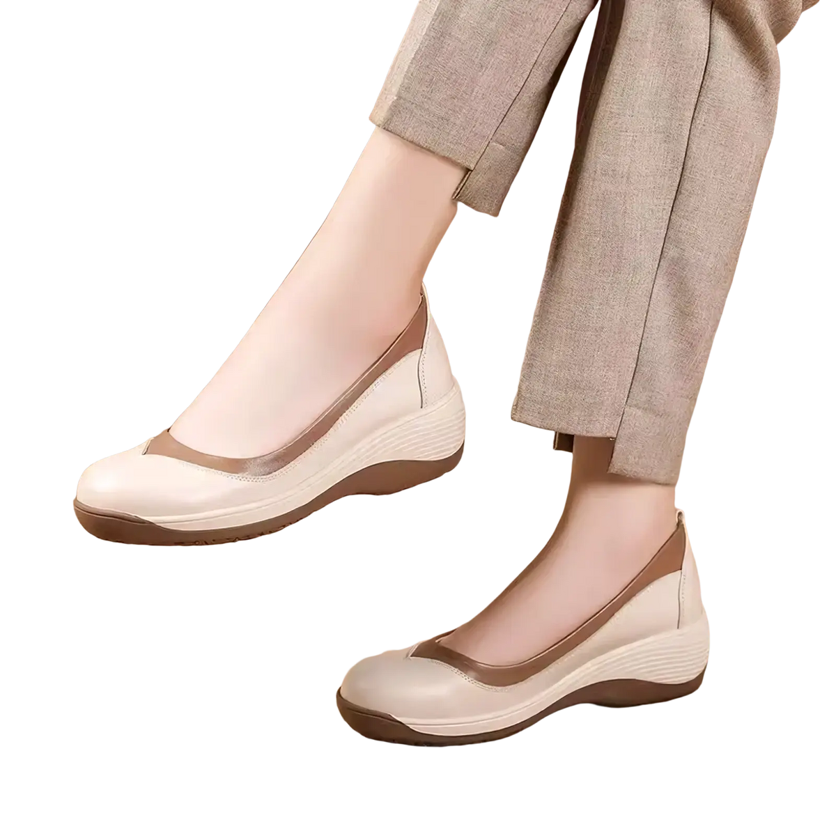 Cream-colored leather wedge flats with tan accent stripe and cushioned sole for casual slip-on wear