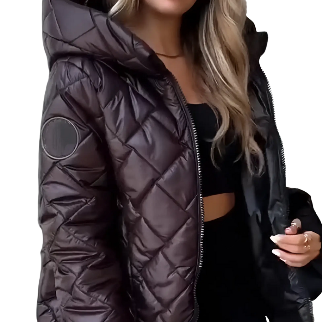 A shiny dark brown quilted lightweight hooded puffer jacket for women with a circular patch on the sleeve