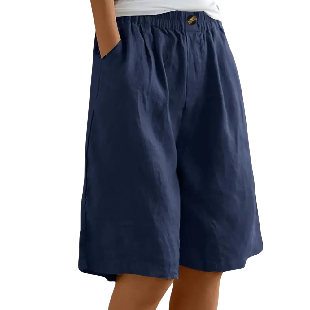 Navy blue women linen bermuda shorts with elastic waist, relaxed pants length, and side pockets with leg opening detail