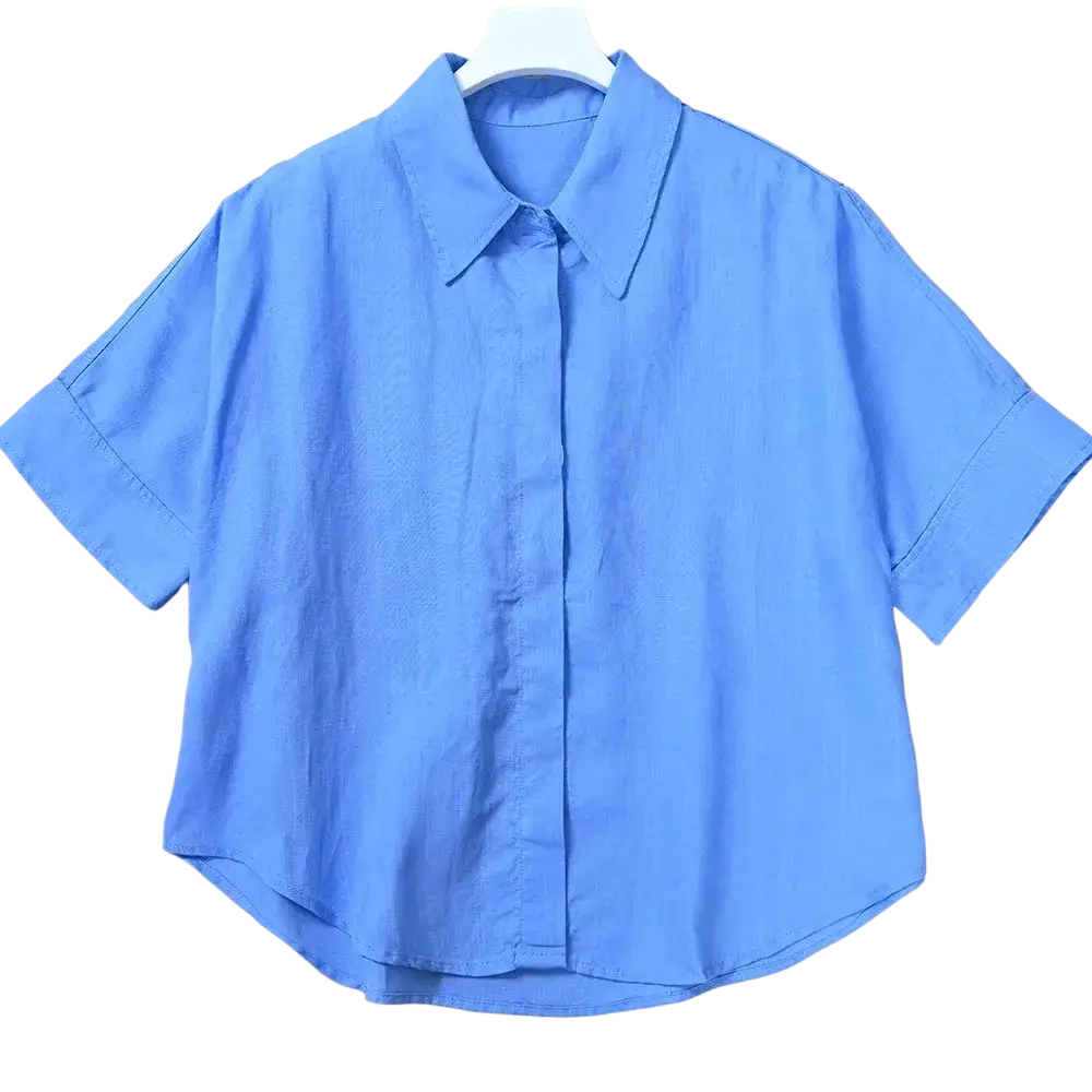 Women linen short sleeve button up shirt in light blue with classic collar and rolled cuffs for casual wear