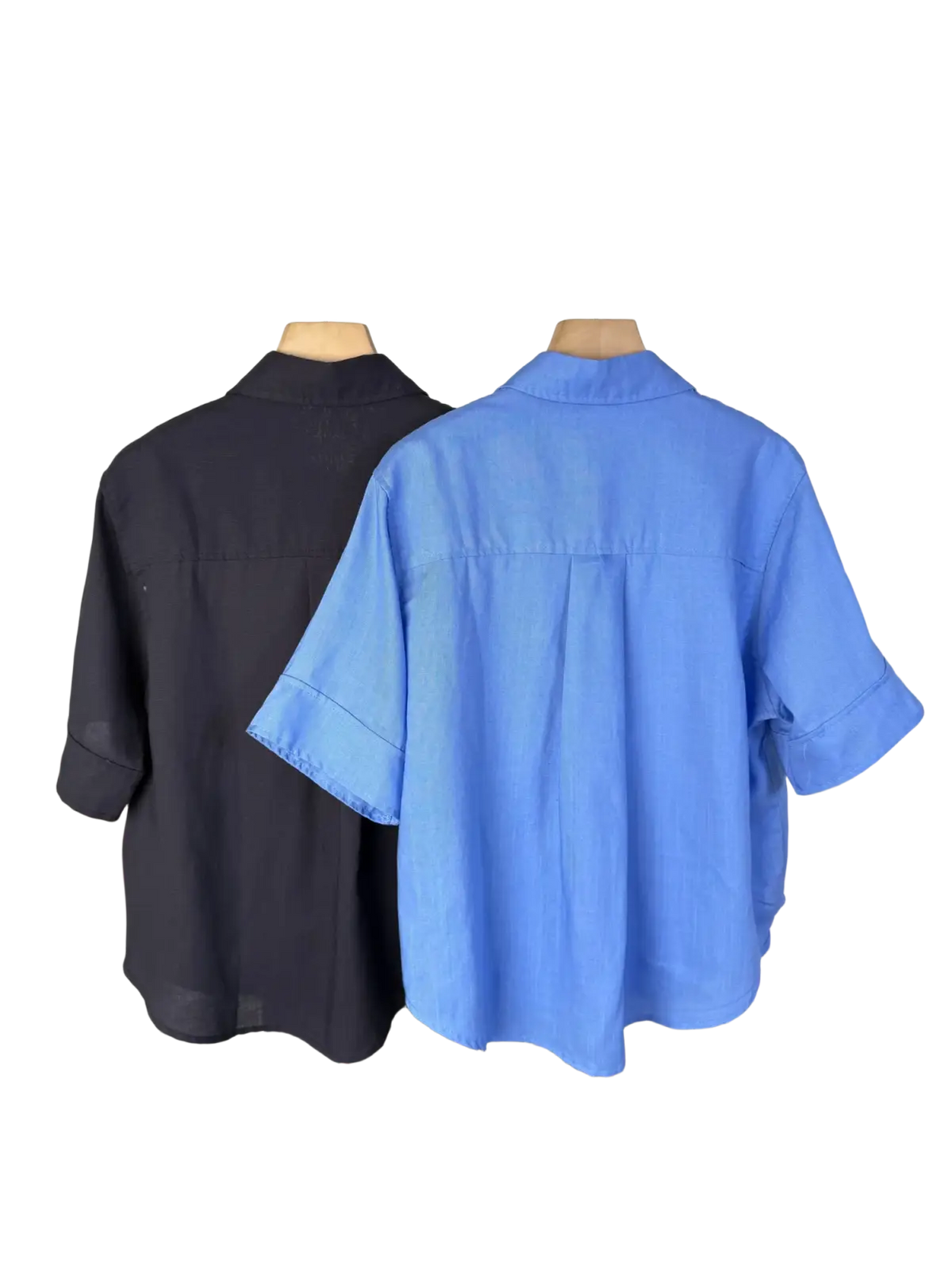 Blue linen women short sleeve button up shirt with collar and rolled cuffs hanging on wooden hanger