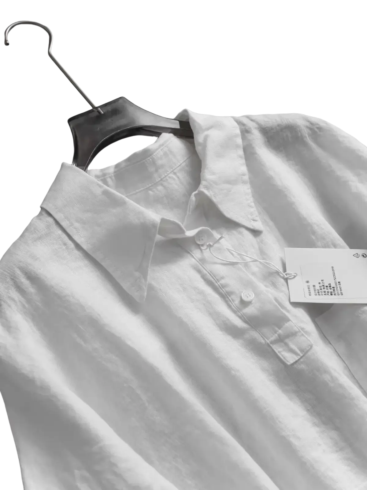 White linen button-up shirt with classic collar and subtle texture in blue for women short sleeve wear
