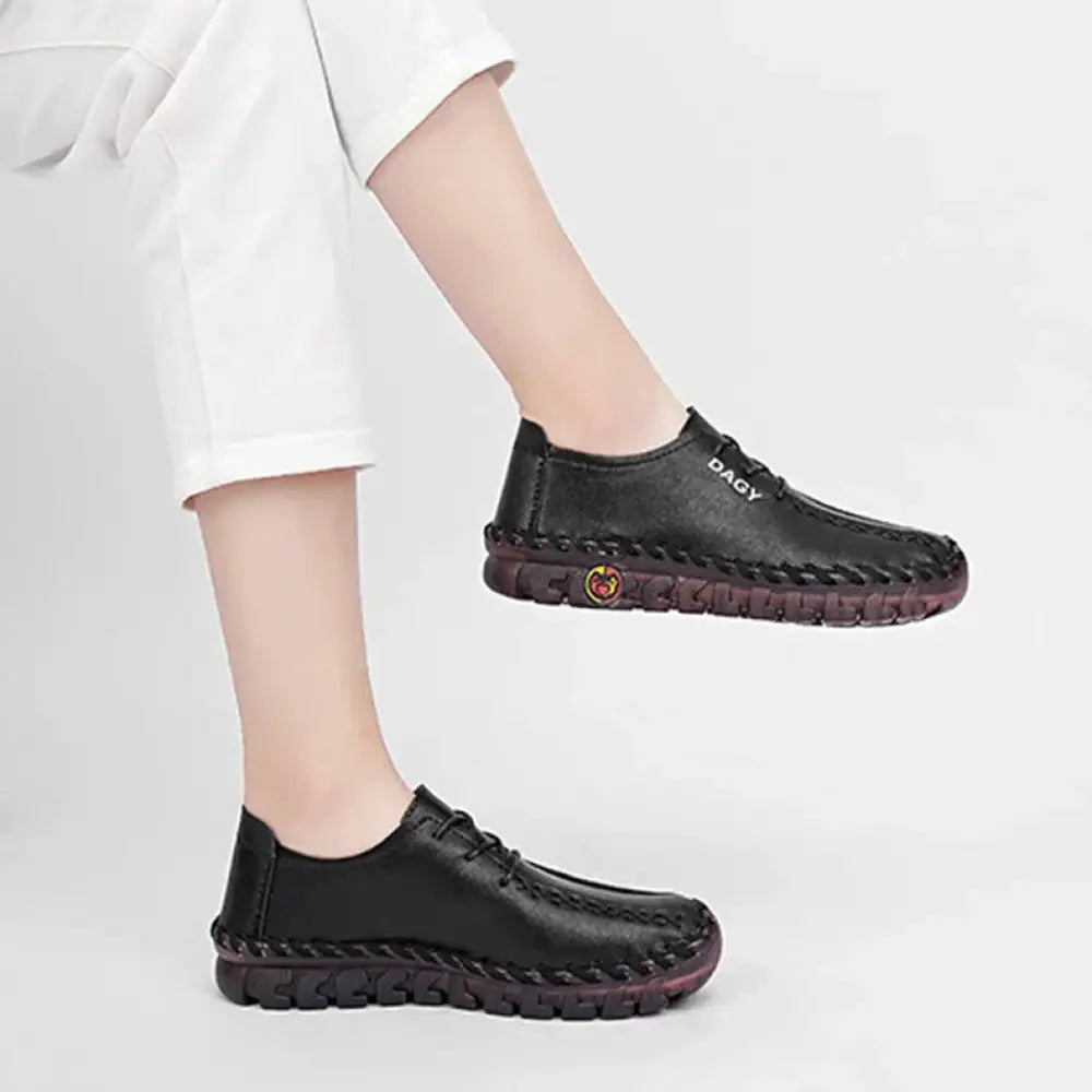 Black leather women’s soft lace-up loafers with braided stitching rubber soles and dagy brand name on the side